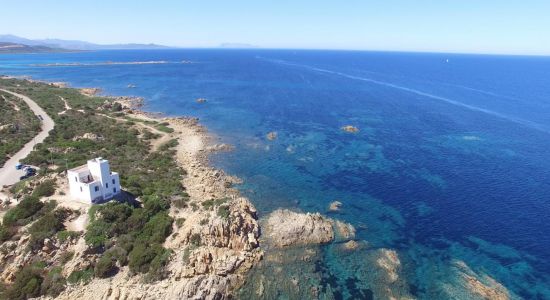Faro di Capo Comino Beach