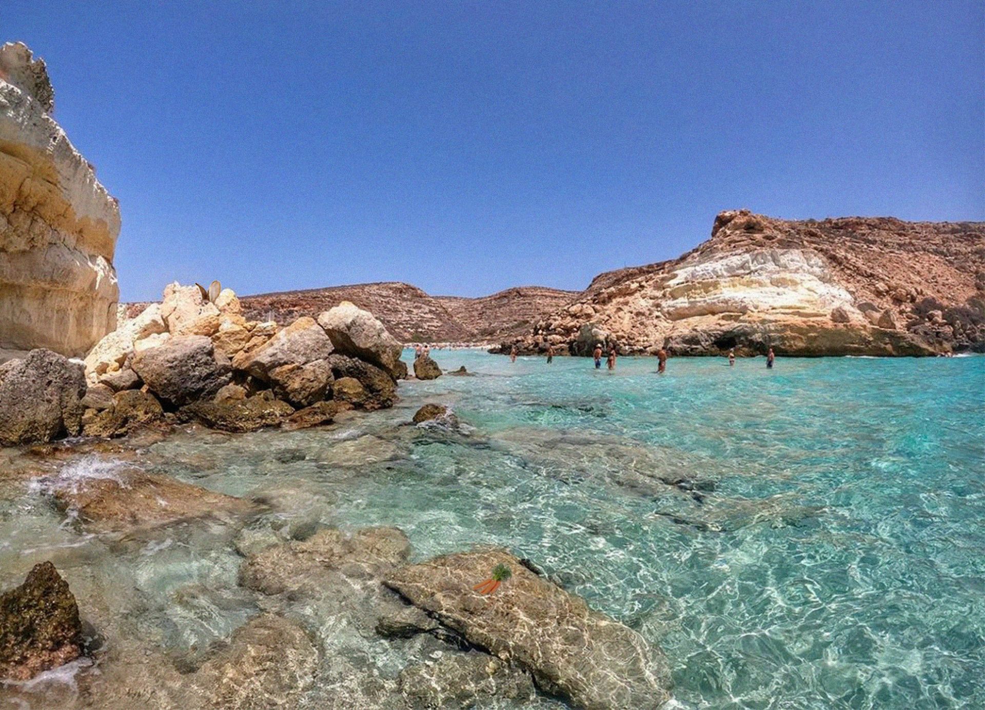 Photo of Dei Conigli Beach with turquoise pure water surface