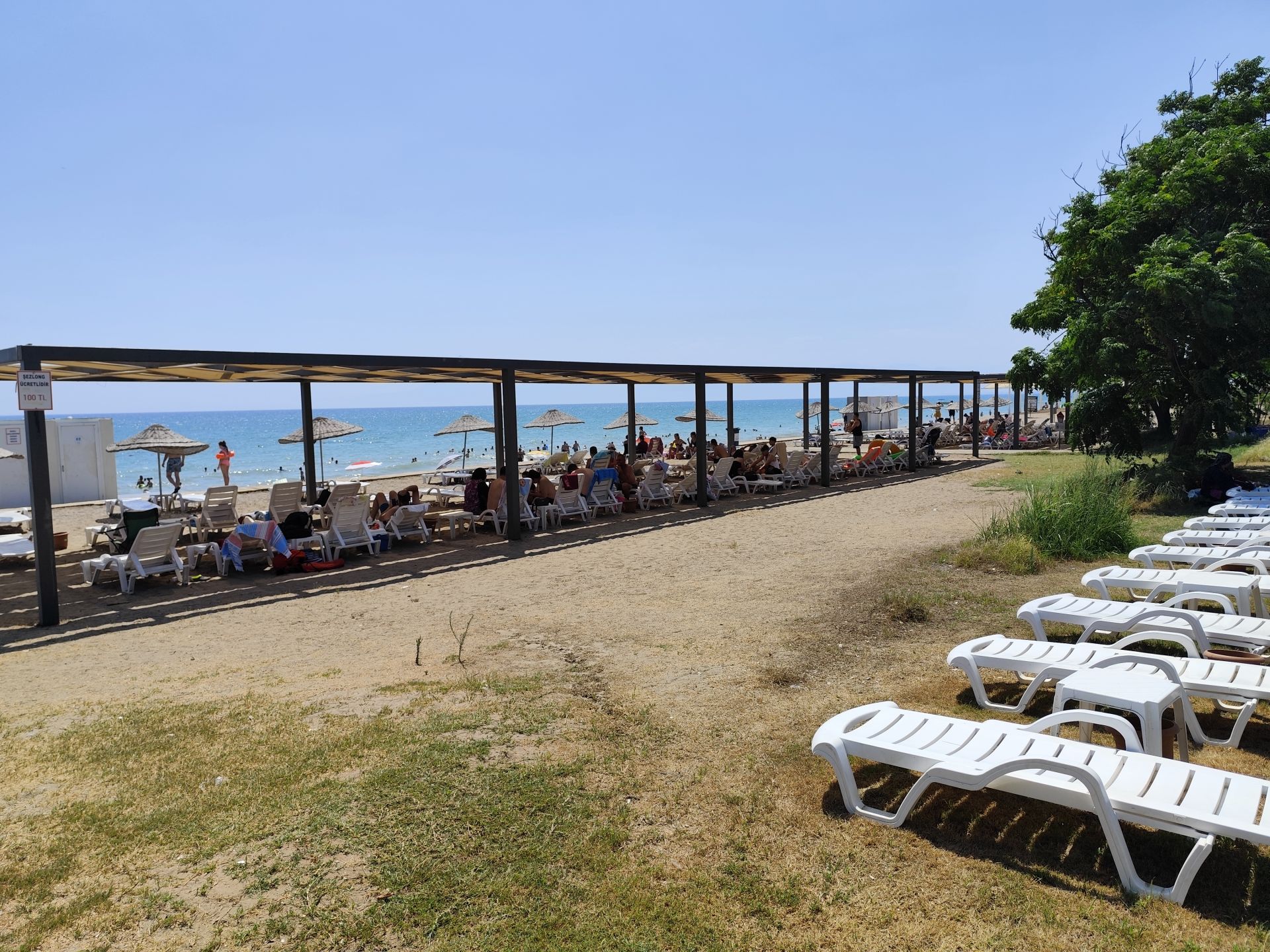 Valokuva Belek Public beachista. pinnalla ruskea hiekka:n kanssa